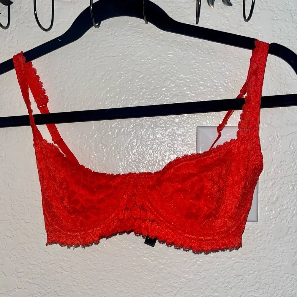 OUT FROM UNDER BRA - Picture 1 of 4